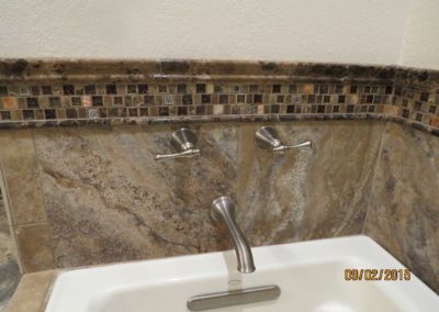 A custom tile-backed bathtub.